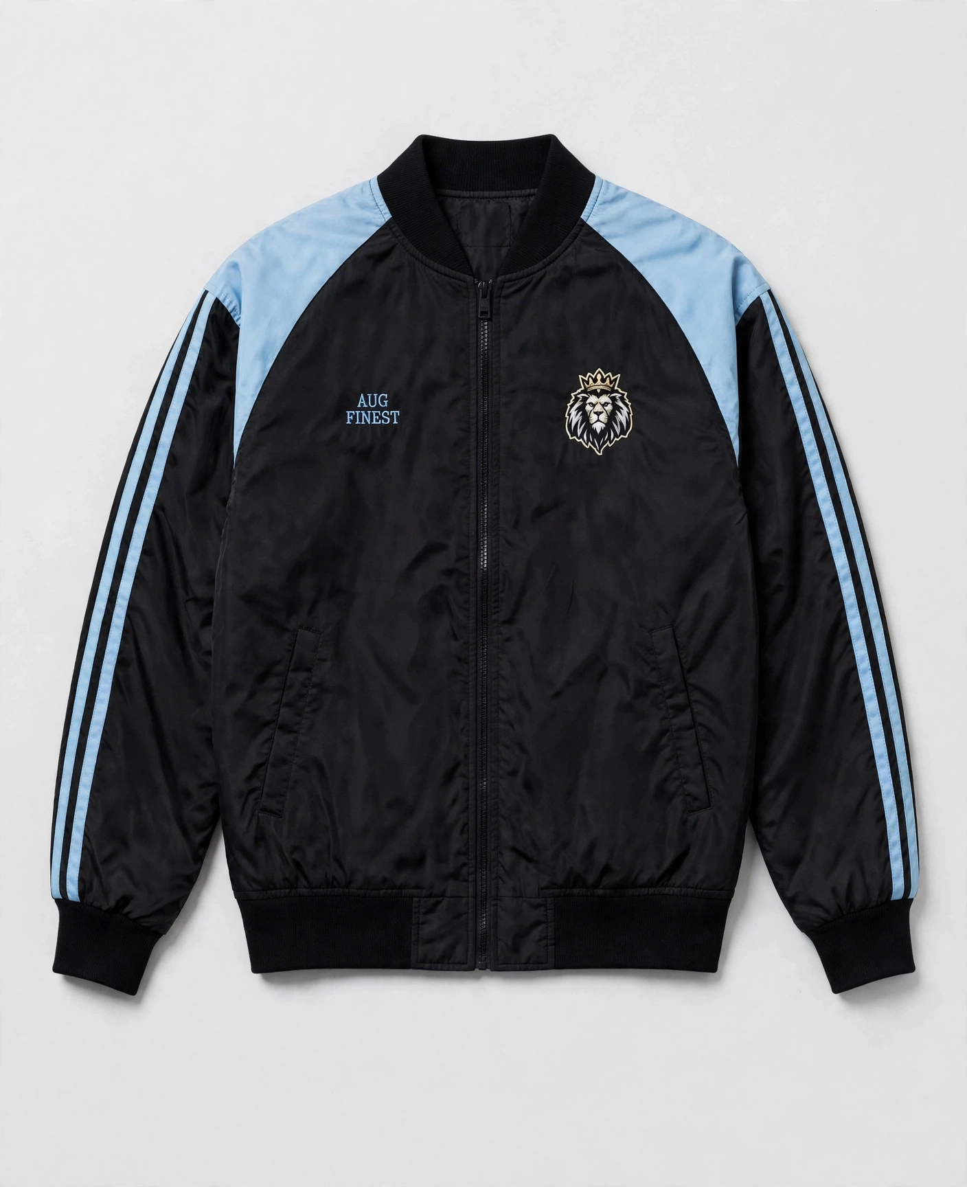 Front of black polyester Aug Fin_Est track jacket with light sky blue shoulder panels and an embroidered crowned lion chest emblem
