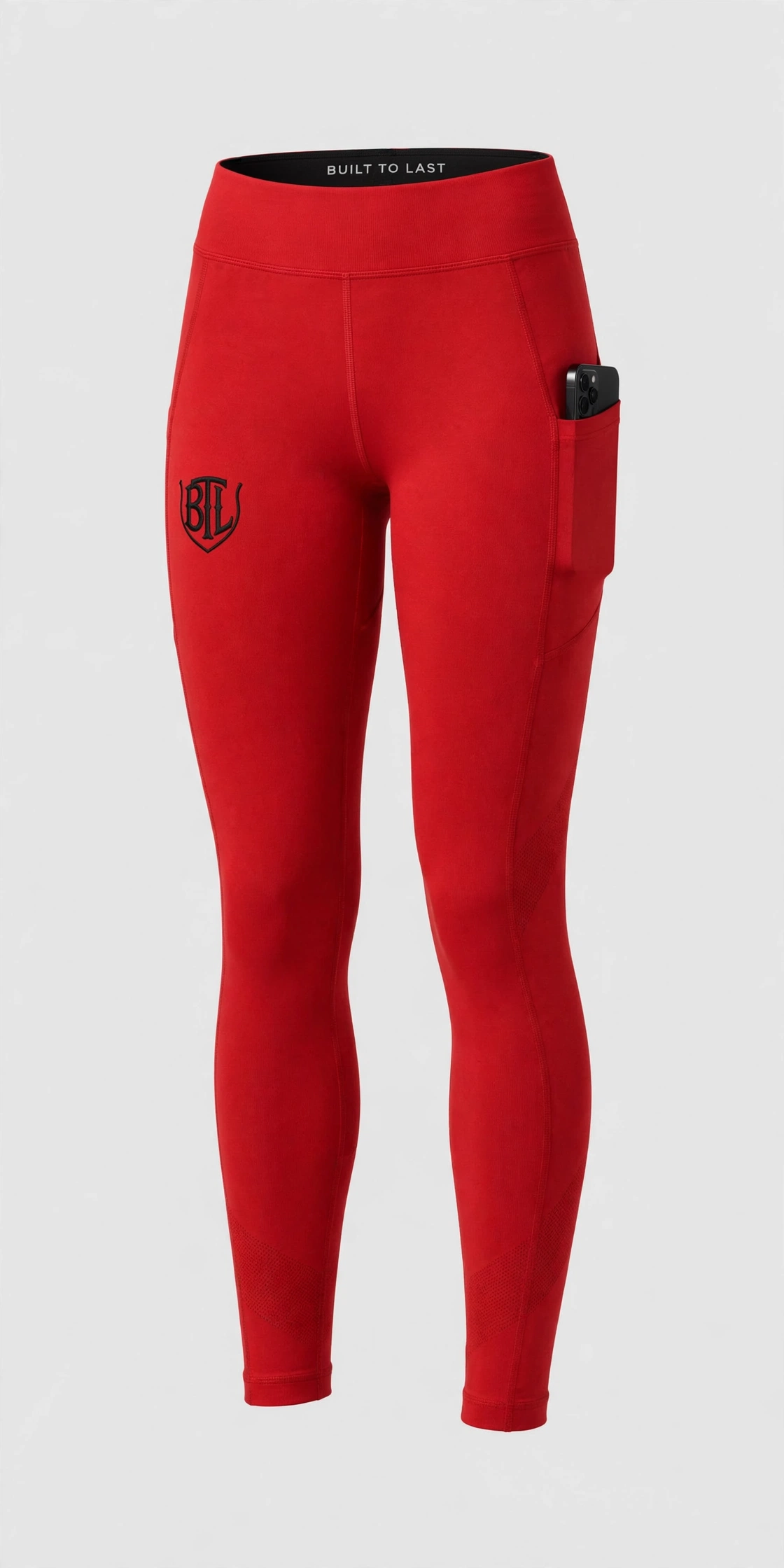 Red Built to Last women’s leggings with black BTL emblem and side phone pocket