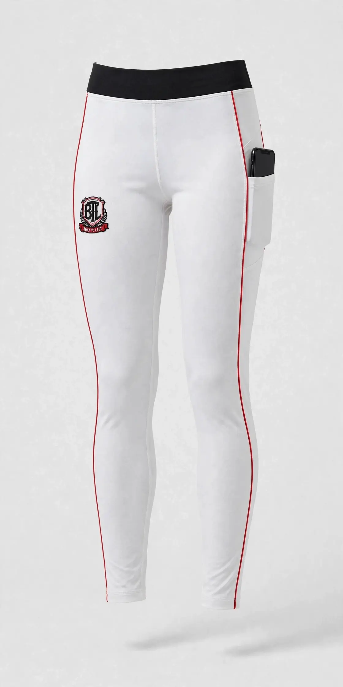 White Built to Last women’s leggings with black waistband, red piping, BTL shield and side phone pocket
