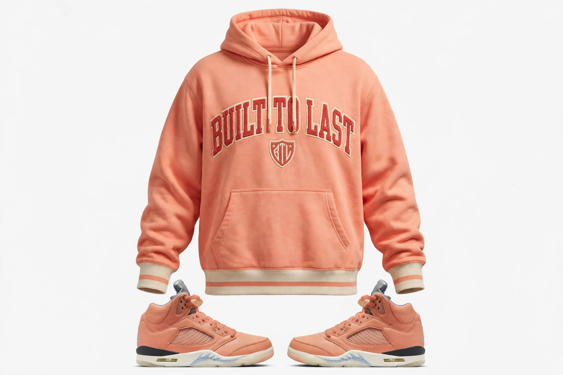 Peach and sail Built to Last varsity hoodie displayed in ghost mannequin style with arched chest lettering and a small shield