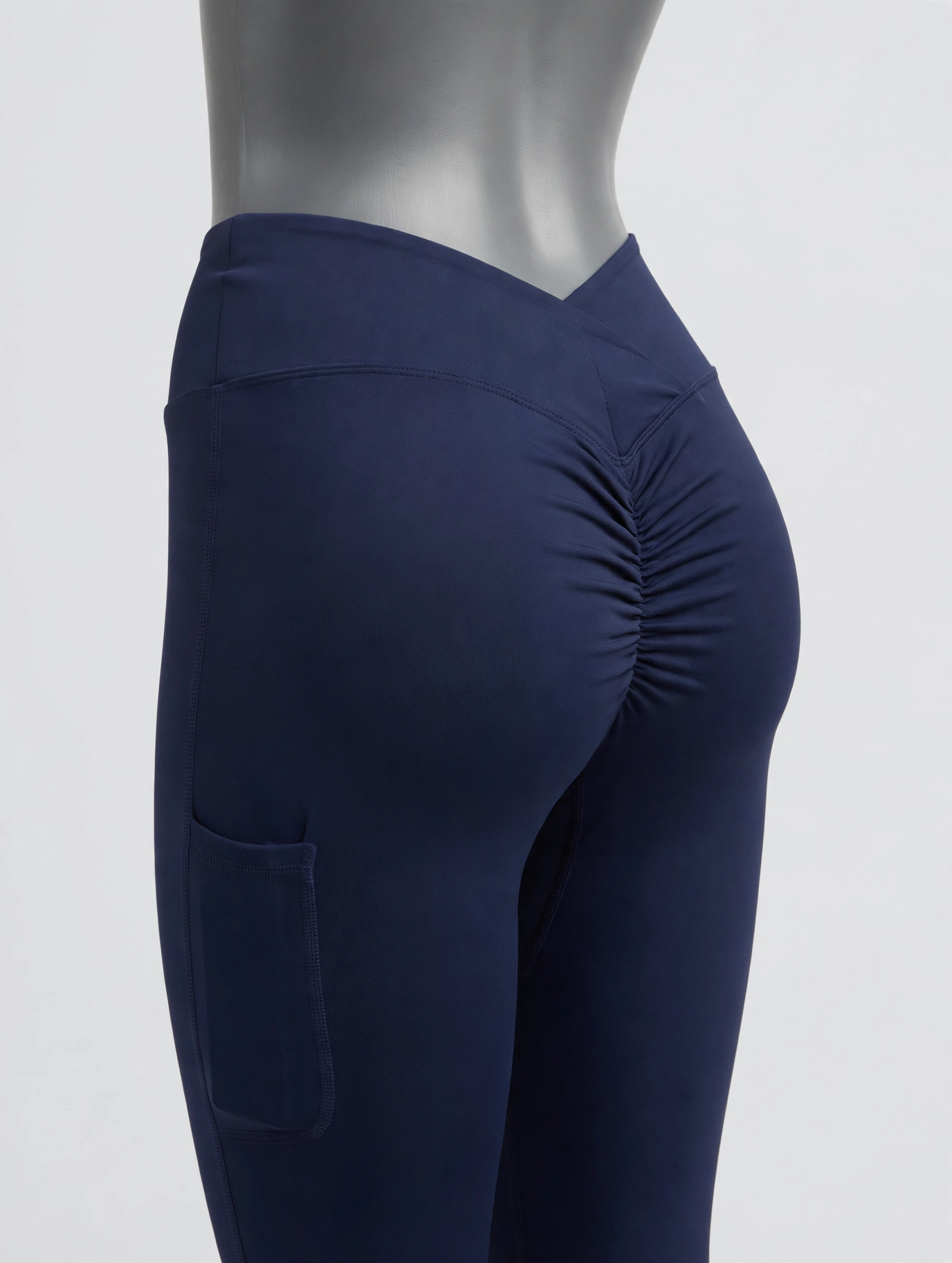 Plain navy scrunch-butt leggings with a side phone pocket, product-only shot with no person wearing them