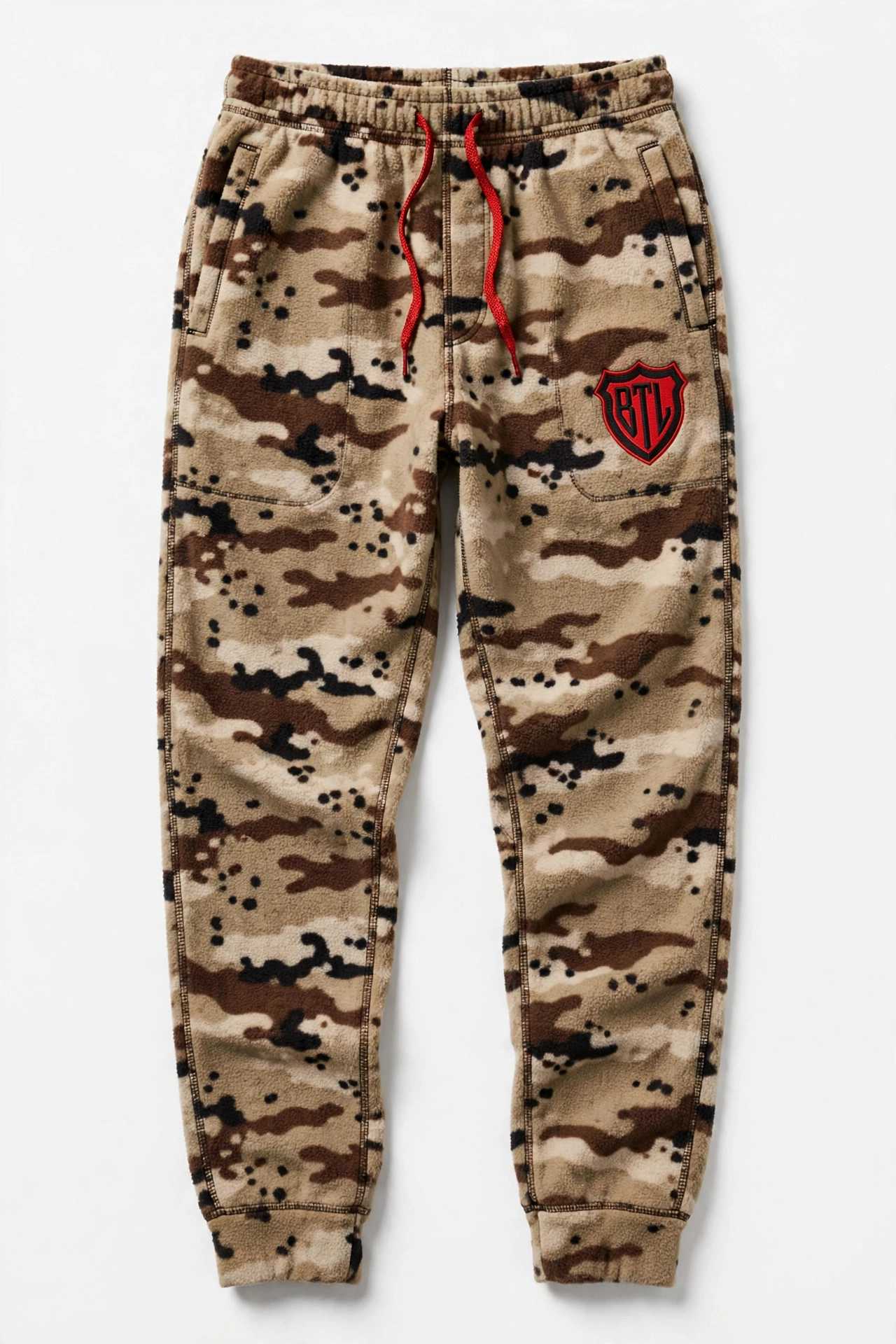 Men’s desert storm chocolate-chip camouflage fleece joggers with cuffed ankles, red drawcord and a Built to Last shield logo on the thigh