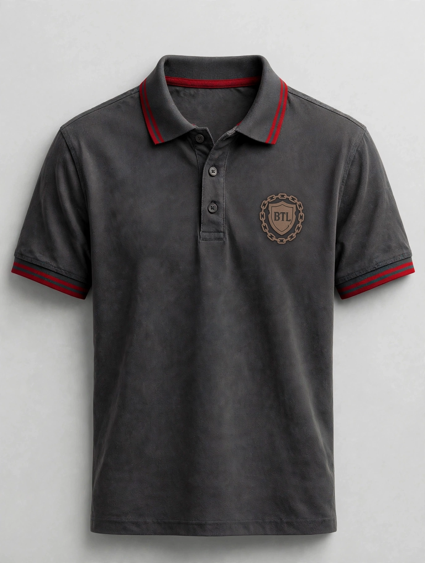 Charcoal men’s Built to Last polo with a small red BTL shield and red collar tipping