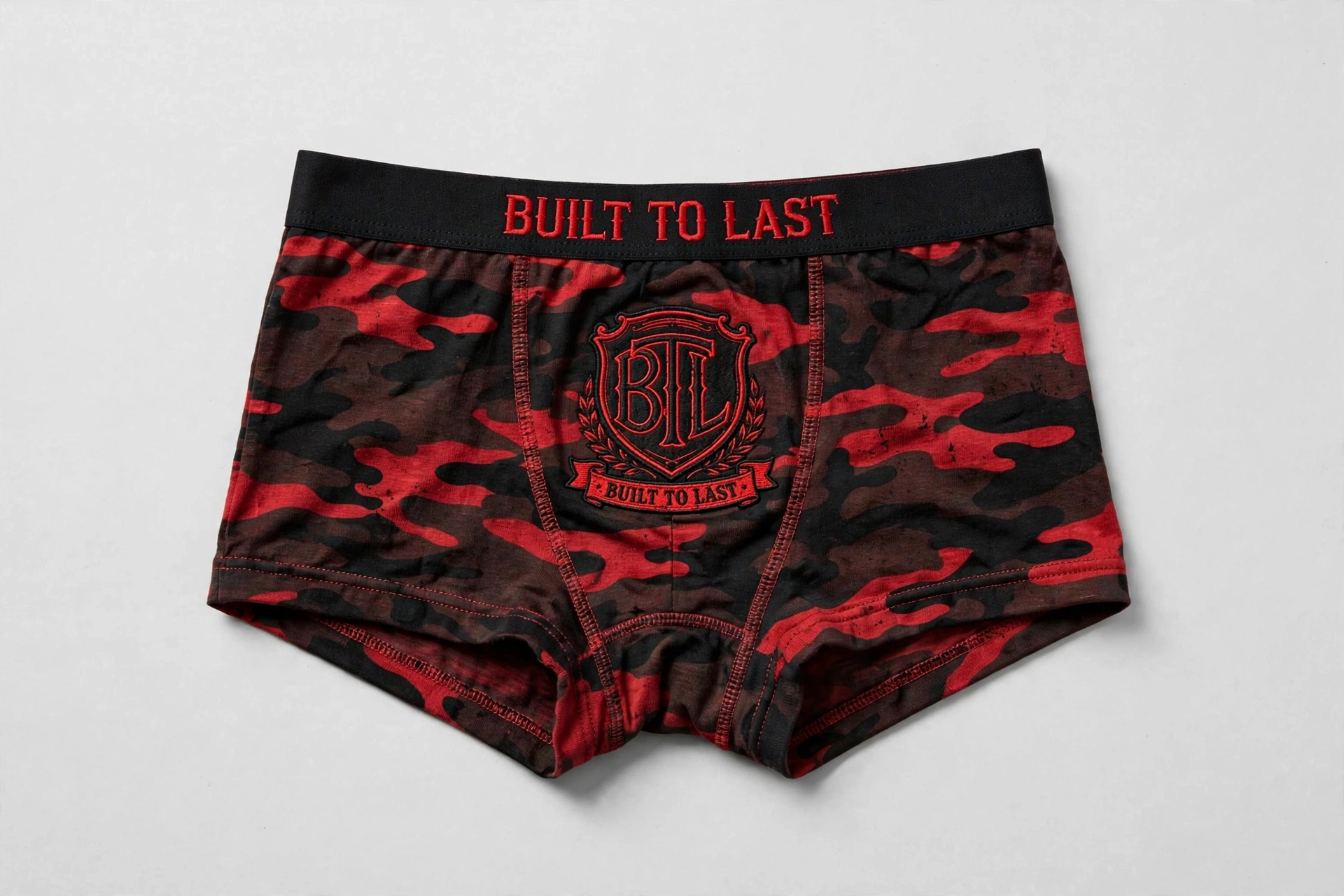 Black and red camouflage Built to Last women’s boyshorts with a red BTL shield and Built to Last waistband