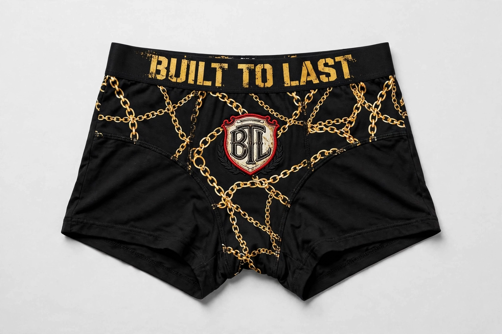 Black Built to Last women’s boyshorts with a gold chain print, red BTL shield and Built to Last waistband
