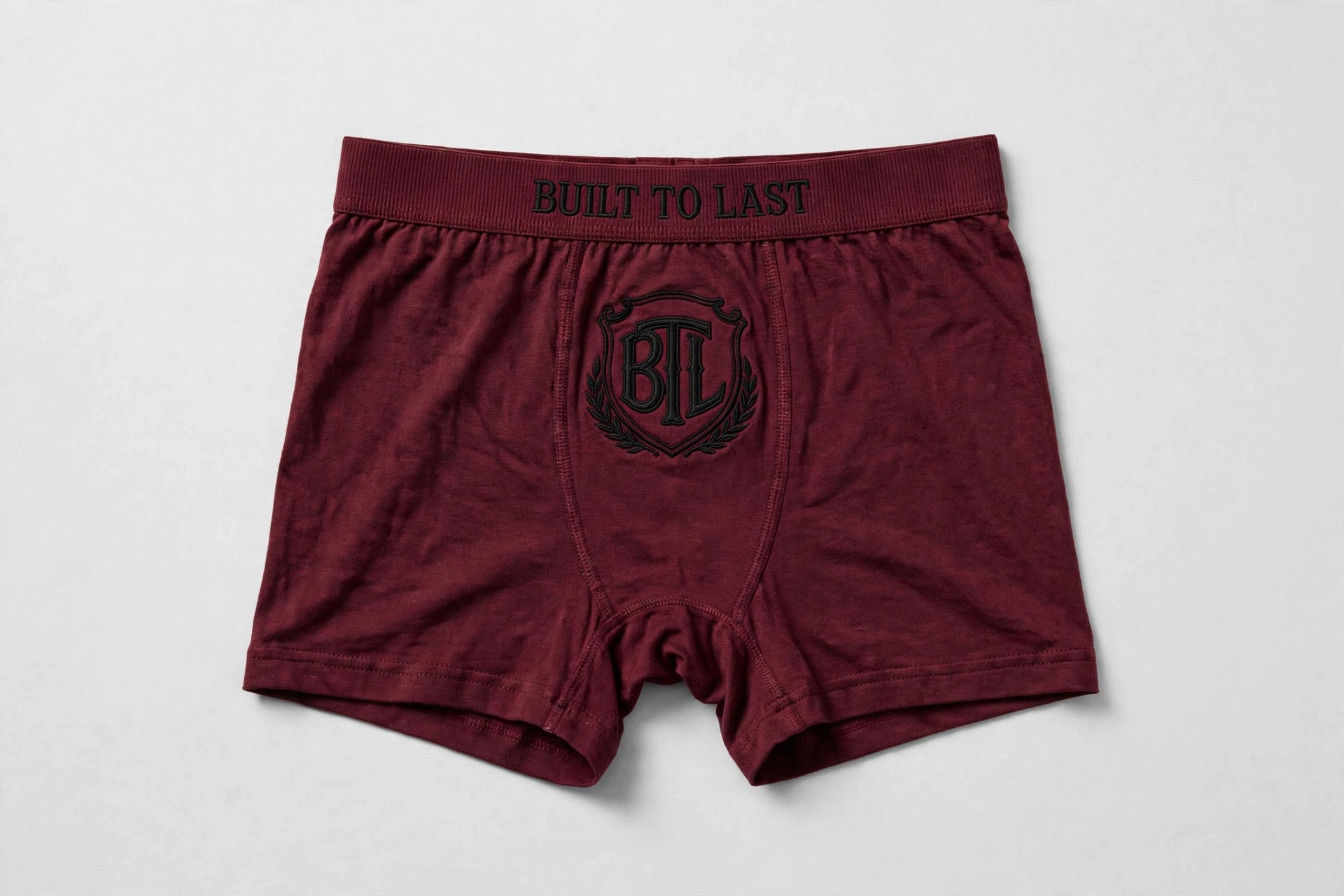 Maroon Built to Last women’s boyshorts with a black BTL shield and Built to Last waistband