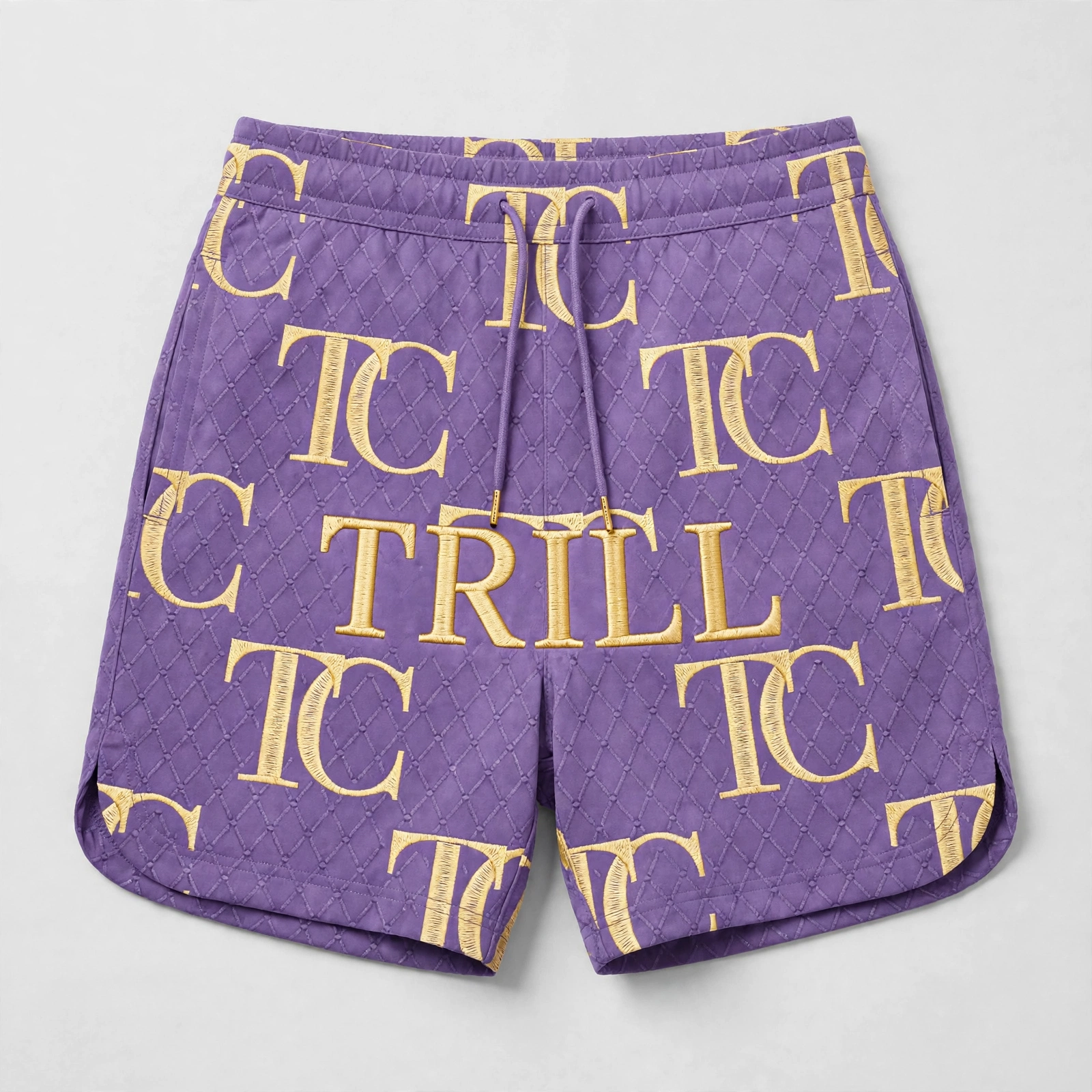 Purple quilted women’s shorts with gold TC monogram print and TRILL lettering across the front