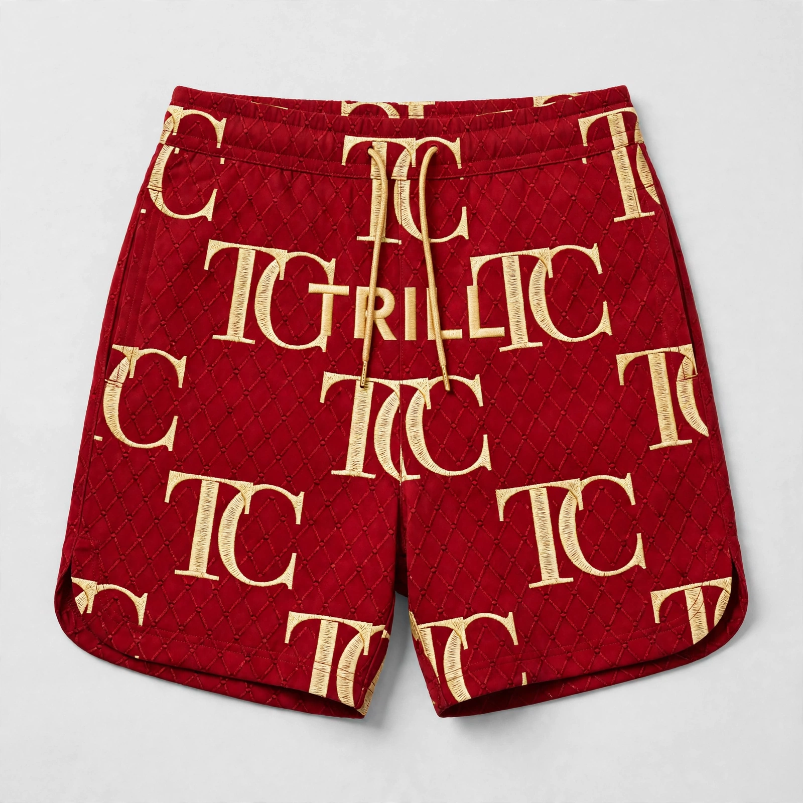 Red quilted women’s shorts with gold TC monogram print and TRILL lettering across the front